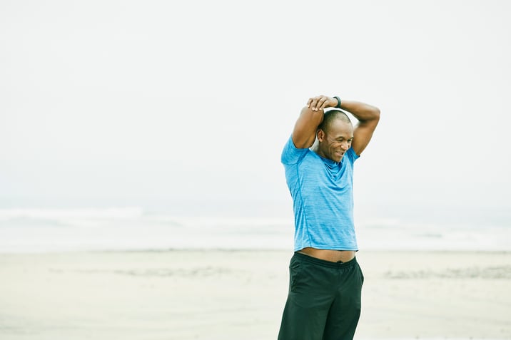 Truck driver stretching for workout while on the road