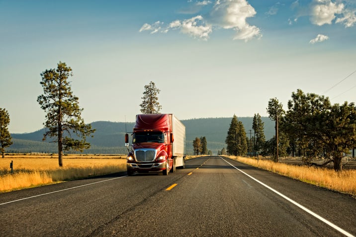 Semi truck on empty highway. Risk control