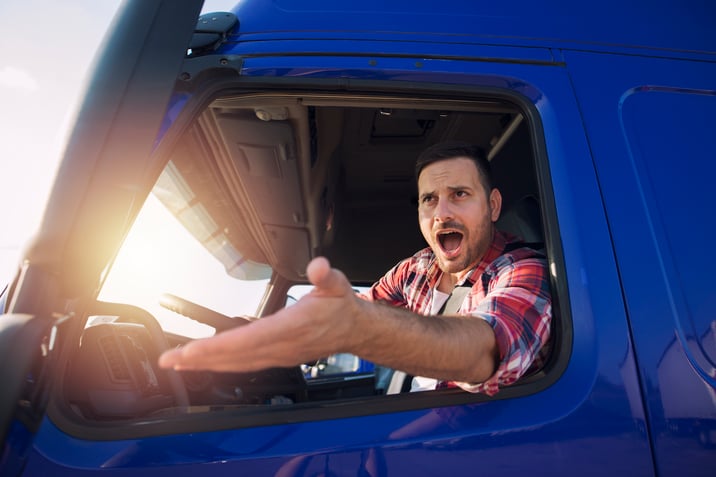 An angry truck driver displaying road rage