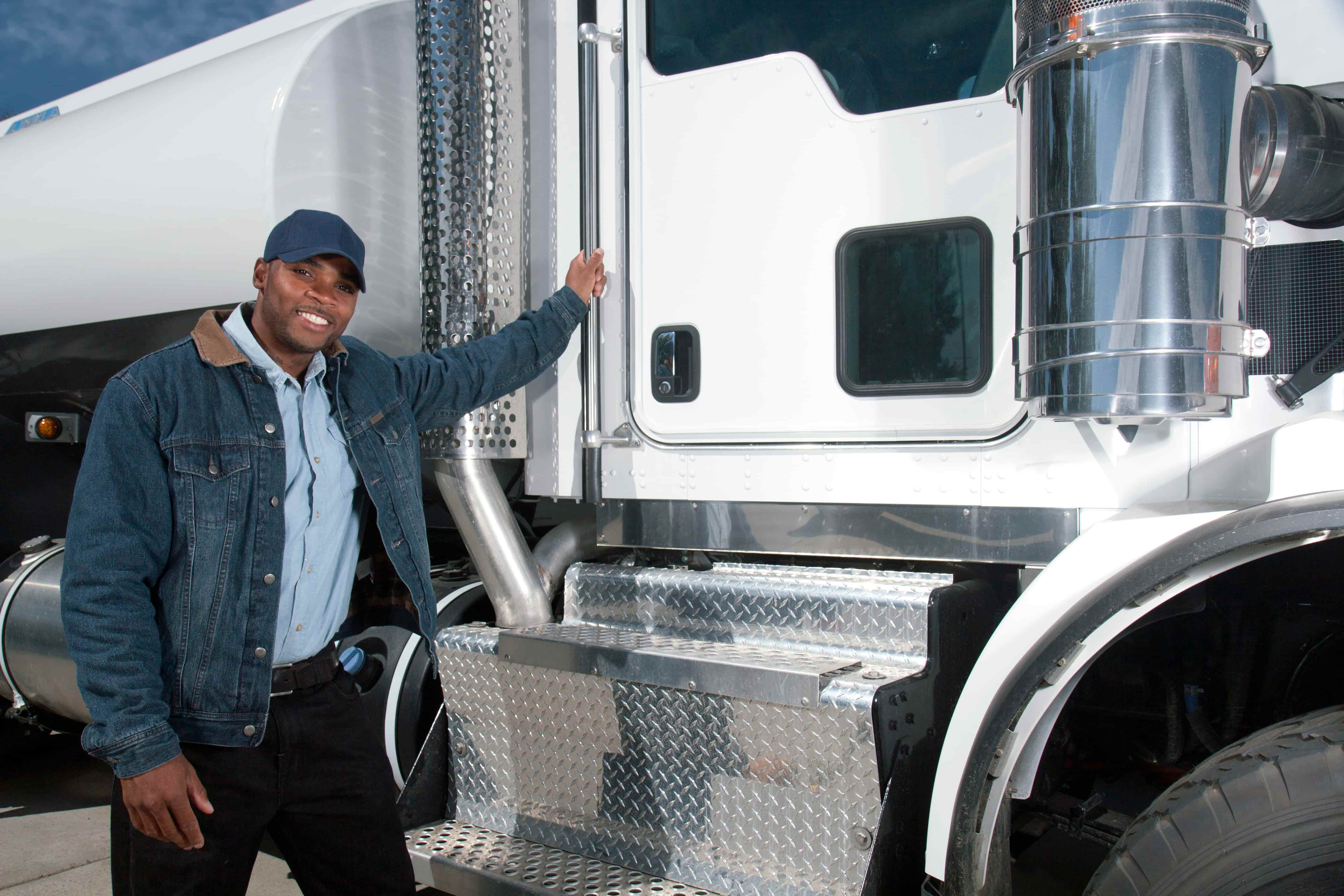 Man standing next to his truck