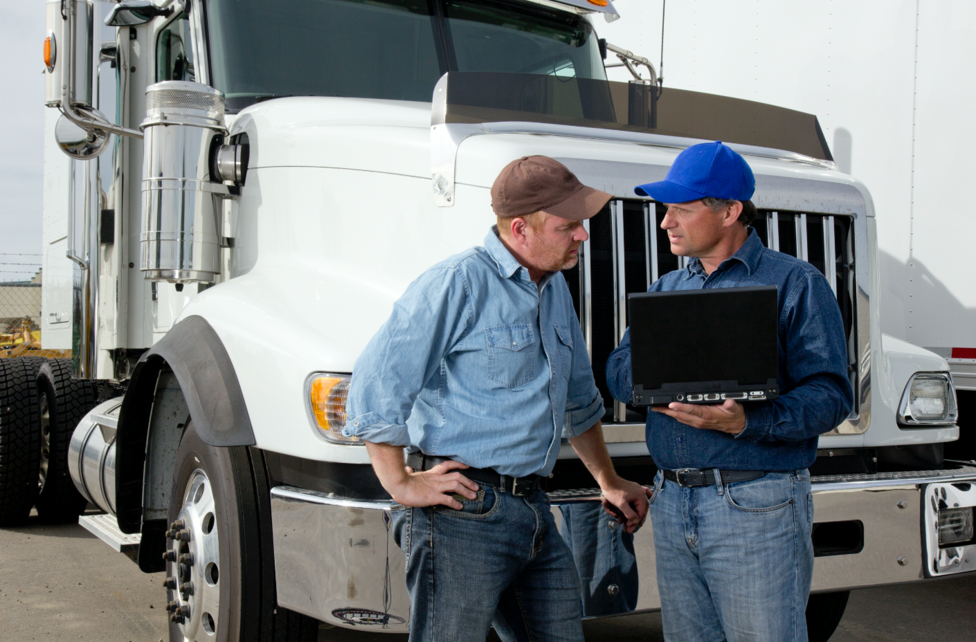 Two men truck drivers talking 