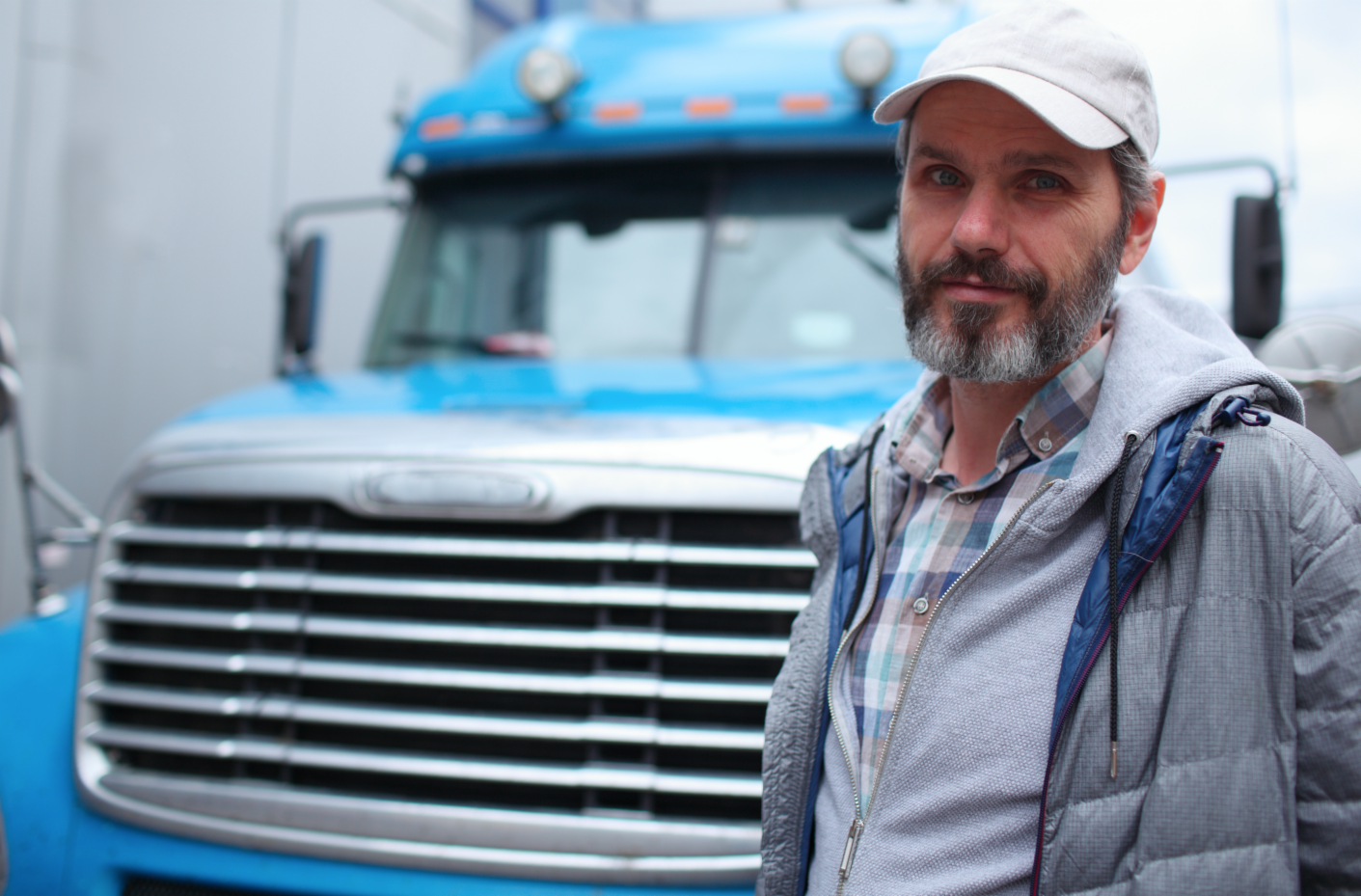 Man posing by truck 