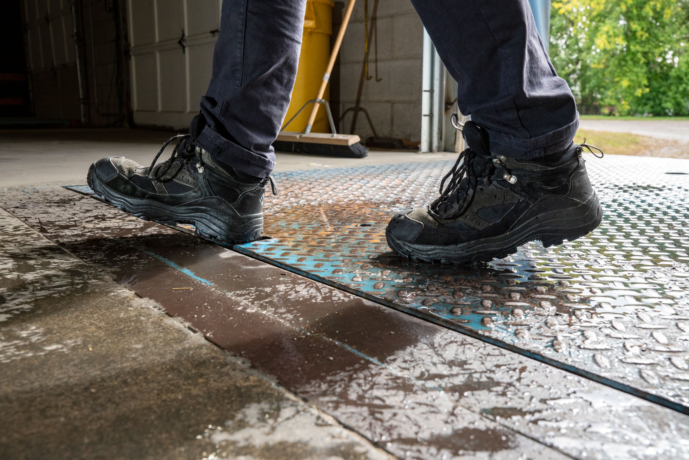 black-boots-walking-on-shop-floor