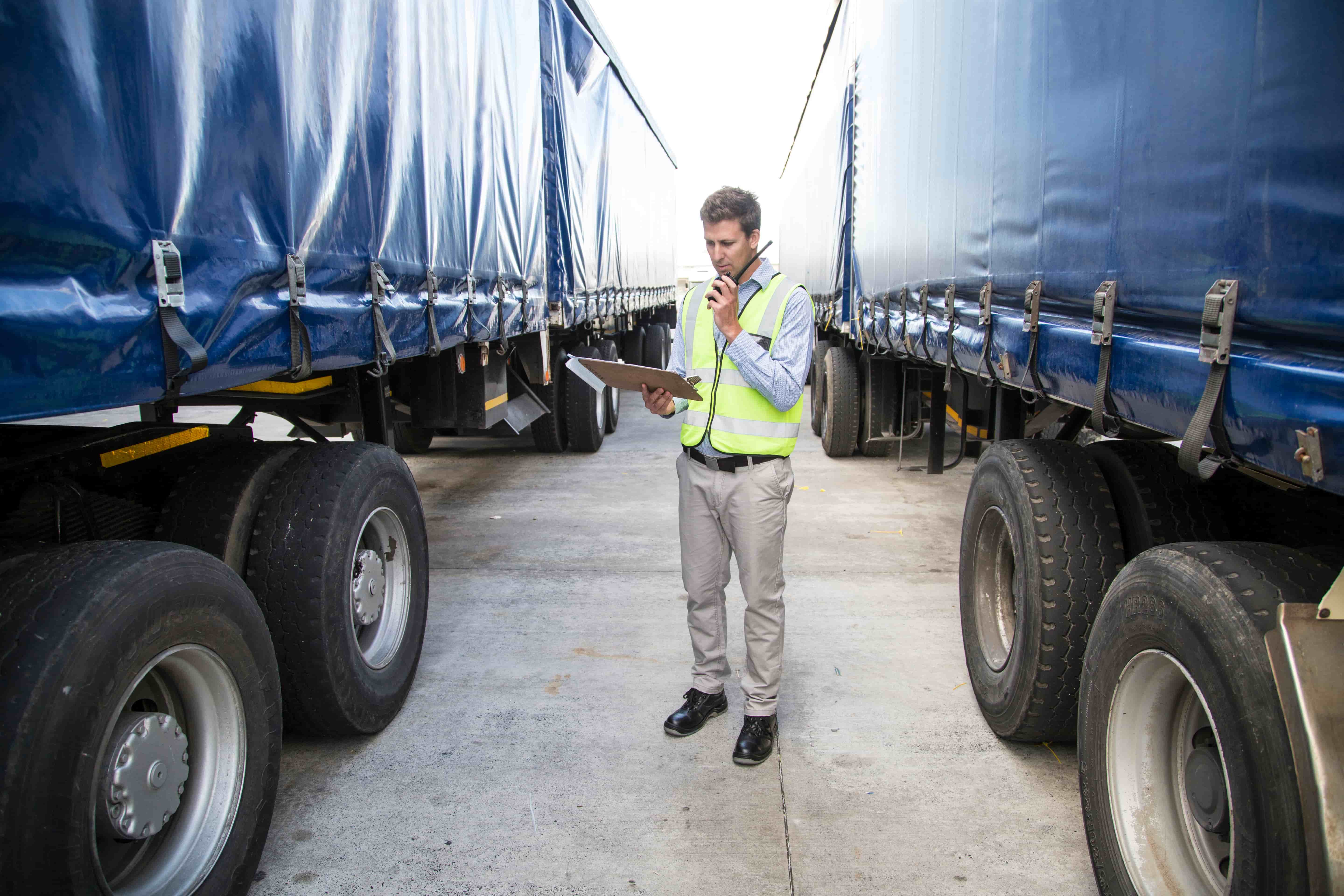 a safety worker inspecting cargo on a trailer