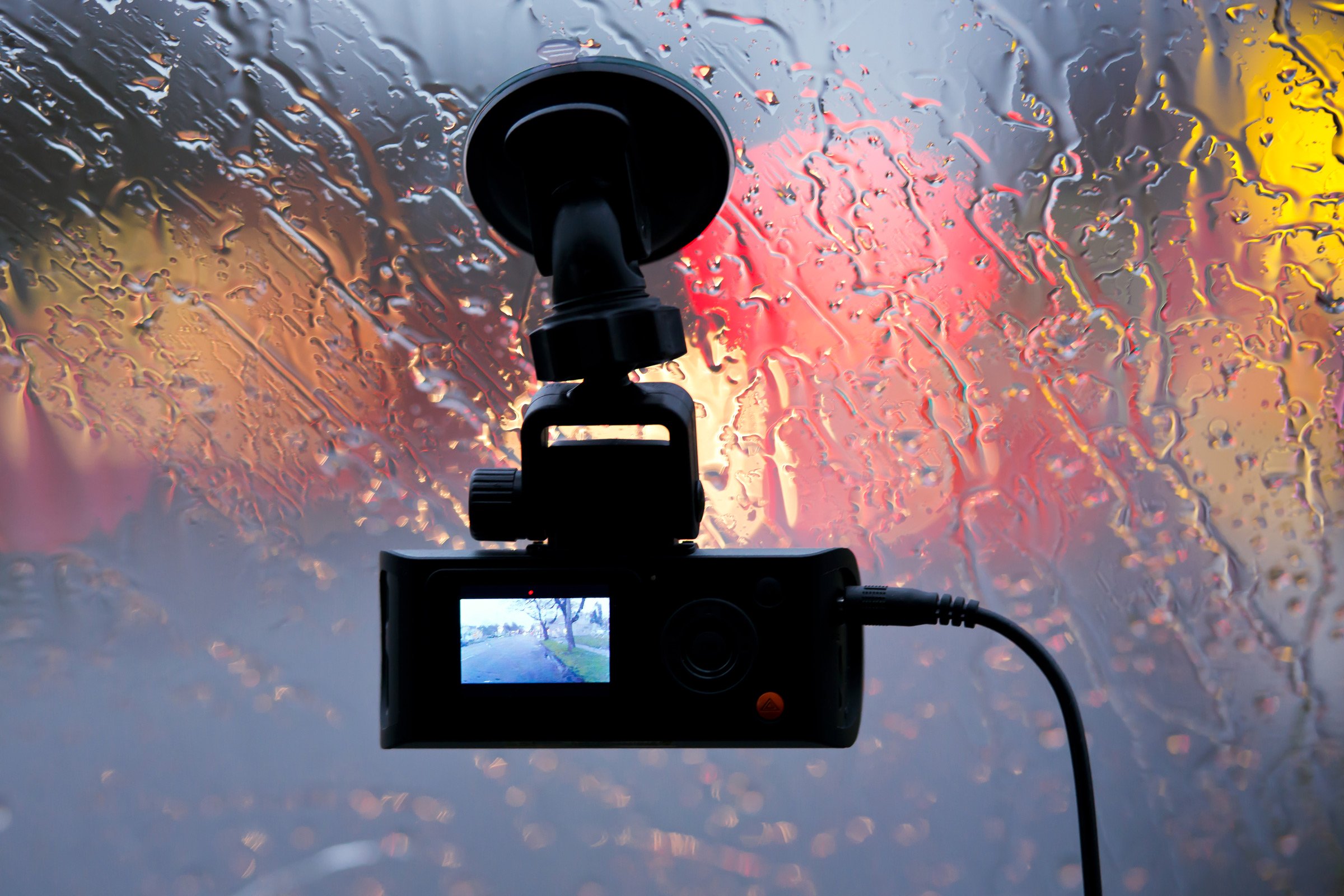 an onboard camera suction cupped to a windshield 